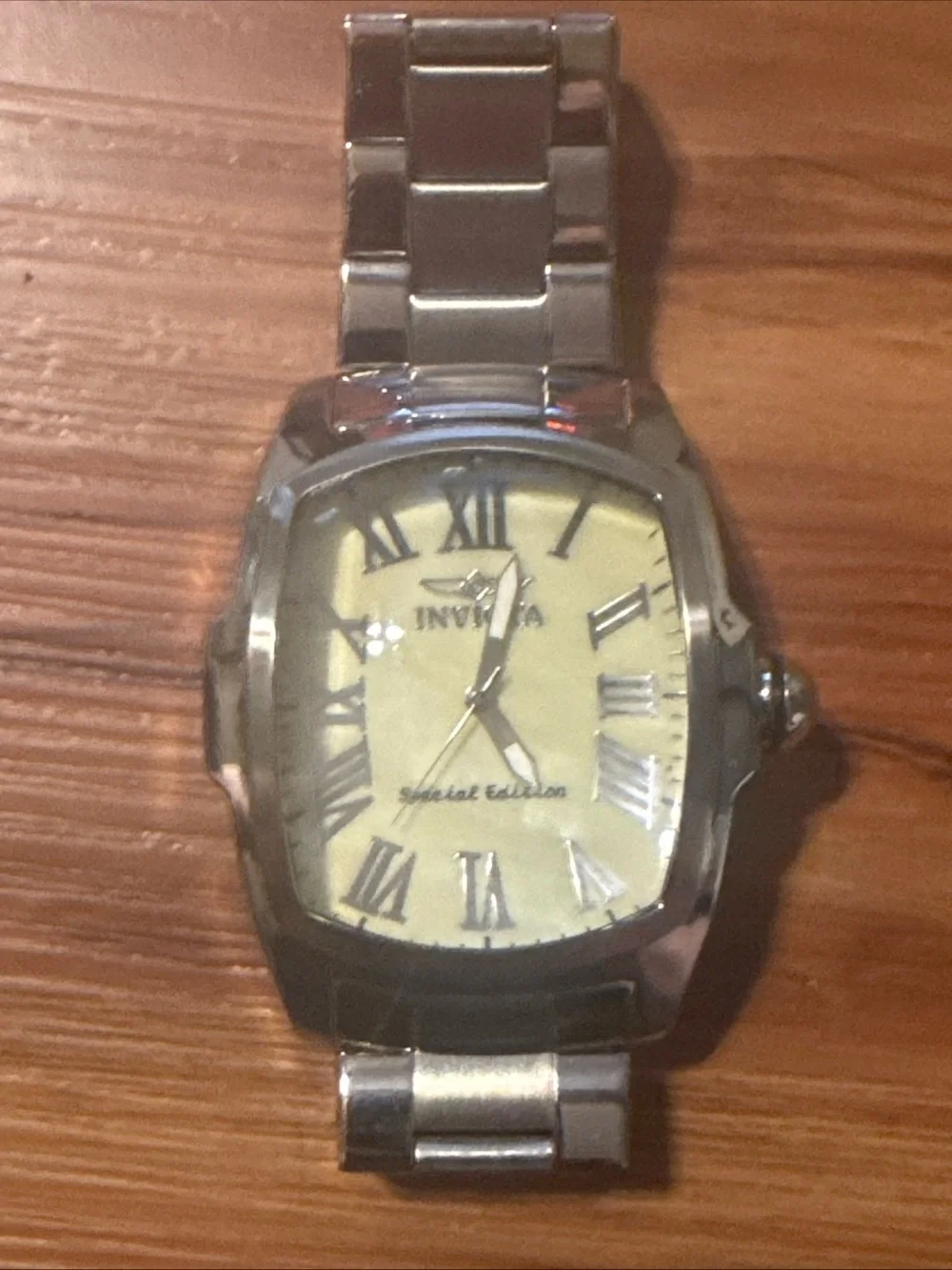 Watch on wooden surface